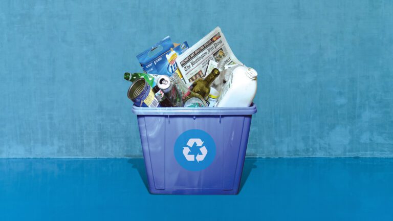 16 Gallon Blue-Bin full of accepted items for recycling.